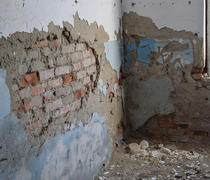 The walls of an old abandoned building. The ruins of the buildings of the twentieth century