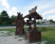 Wooden well and a windmill. Wooden decorations