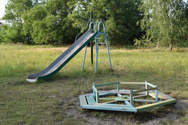 Children playground. Swings and a slide to slide