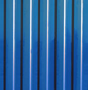 Diagonal pattern of metal profile. Fences from the galvanized iron painted by a polymeric covering