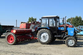 Tractor, standing in a row. Agricultural machinery. Parking of agricultural machinery.