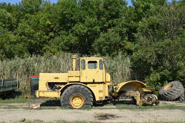Big yellow tractor. Old Soviet agricultural machinery.