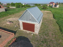 Top view of the garage in a private plot of land. Private construction.
