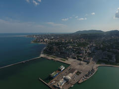 Top view of the marina and quay of Novorossiysk. Urban landscape of the port city.