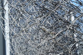 Background of folded mesh netting. Grey mesh netting