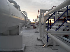 The area of the equipment to cool the oil product.  Equipment for primary oil refining