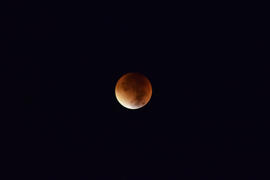 Total lunar eclipse. Orange Moon during an eclipse