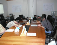 The sleeping office workers. subordinates were tired of waiting the chief and fell asleep.