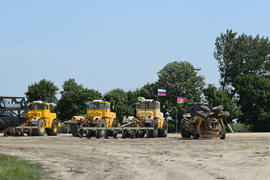 Russia, Temryuk - 15 July 2015: Tractor, standing in a row. Agricultural machinery. Parking of agric