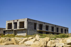 Unfinished building of gray block. Home construction.