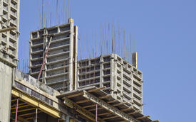 Construction of a multistory building. Installation of the concrete walls of the building.