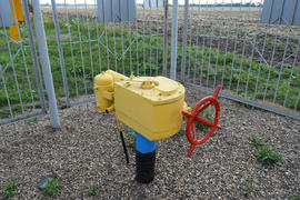 The latch on the underground gas pipeline protected with a fence