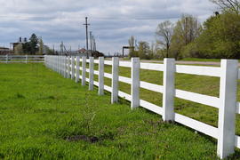 WhiteWhite wooden fence around the ranch. Wooden fence in the village