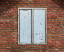 Window in a brick wall. Construction of the house