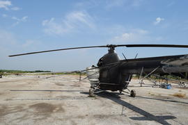 Old helicopter spraying fields. Helicopter spraying fertilizer.