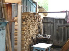 Pile of chipped firewood. Private Russian yard