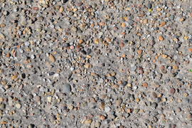 Pellet in old asphalt. Background texture of the old road