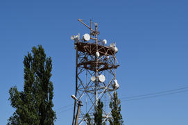 Satellite antennas and repeaters on the tower. Telecommunications