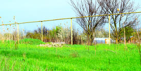 Gas pipe on the background of grass. Gas supply in the village
