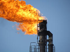 System of a torch on an oil field. Burning through a torch head