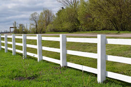 WhiteWhite wooden fence around the ranch. Wooden fence in the village