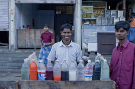 Soda seller on the streets of Mumbai with the buyer
