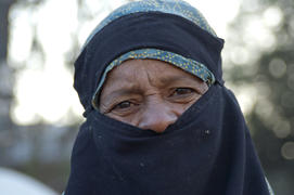 Eyes of an elderly woman in a burqa on the street in Karachi