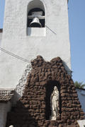 Bell tower and the statue of the Virgin Mary in South Goa