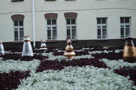 Decorative chess pieces on a bed in the center of Bobruisk