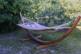 Fixing the hammock in the yard of a private house