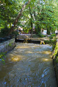 Mountain river in the city. The river, which flows in a narrow deep valley with steep slopes.