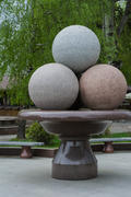 Monument to ice cream. Vase with ice cream balls. Each ball is made from different colored granite.