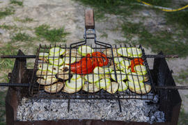 Pickled vegetables grilled over charcoal on the grill