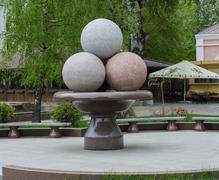 Monument to ice cream. Vase with ice cream balls. Each ball is made from different colored granite. 