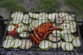 Pickled vegetables grilled over charcoal on the grill