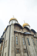 The orthodox church in cloudy weather lights the world with the domes