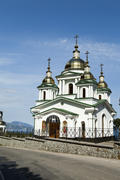 Orthodox church in beams of a bright sun against the blue sky
