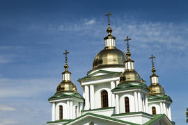 Orthodox church in beams of a bright sun against the blue sky