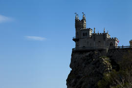 The castle by the sea is on the rock highly above water