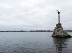 Monument to the flooded Russian ships in a bay