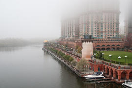 Building on the waterfront in the fog